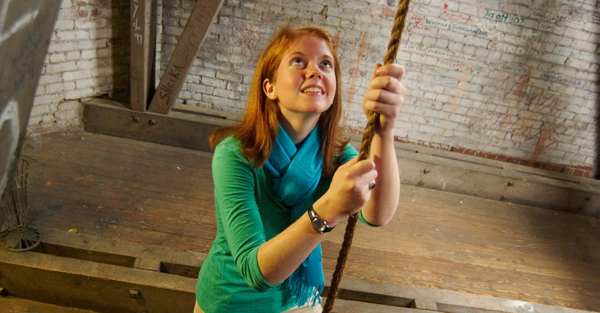 a female student ringing the bell