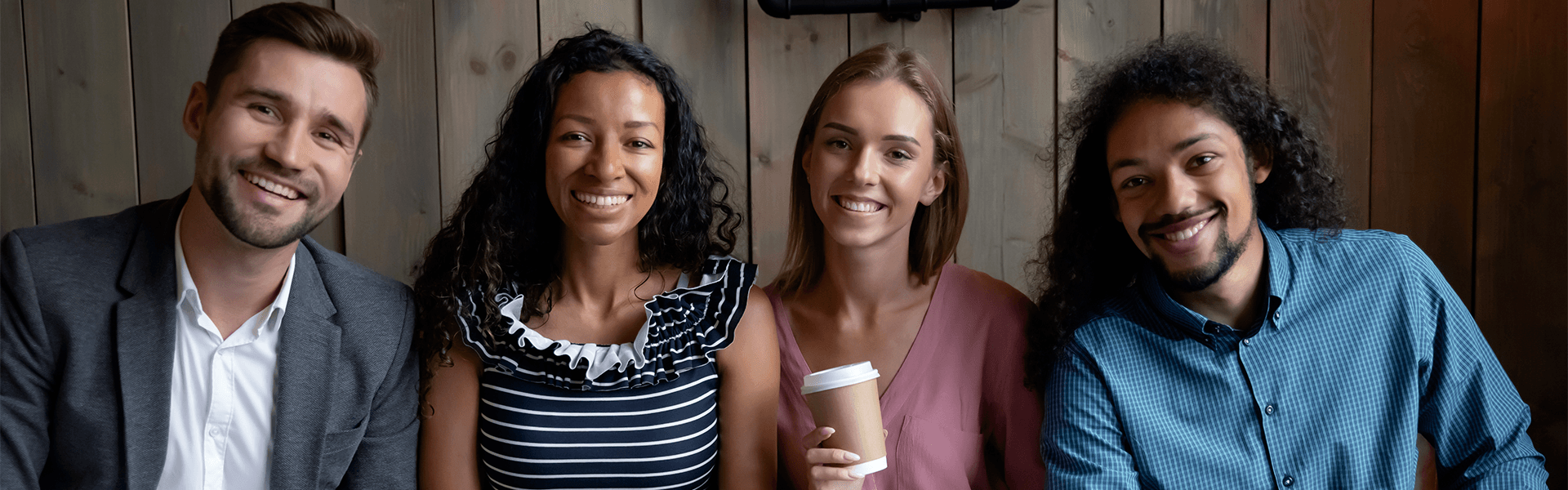 three female students working at a computer together