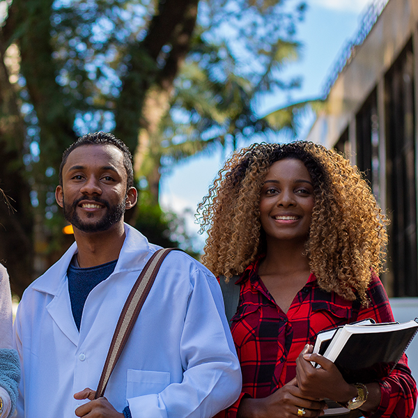 Allied health sciences students posing and smiling.