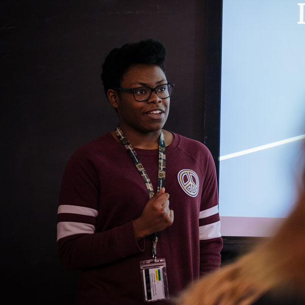 An Agnes Scott mathematics-physics major stands in front of her class and speaks.
