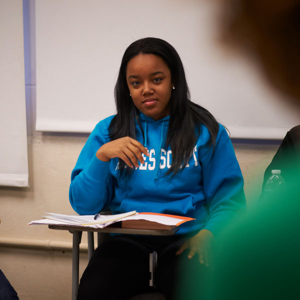 An Agnes Scott College Spanish major student looks up from her notebook in class.