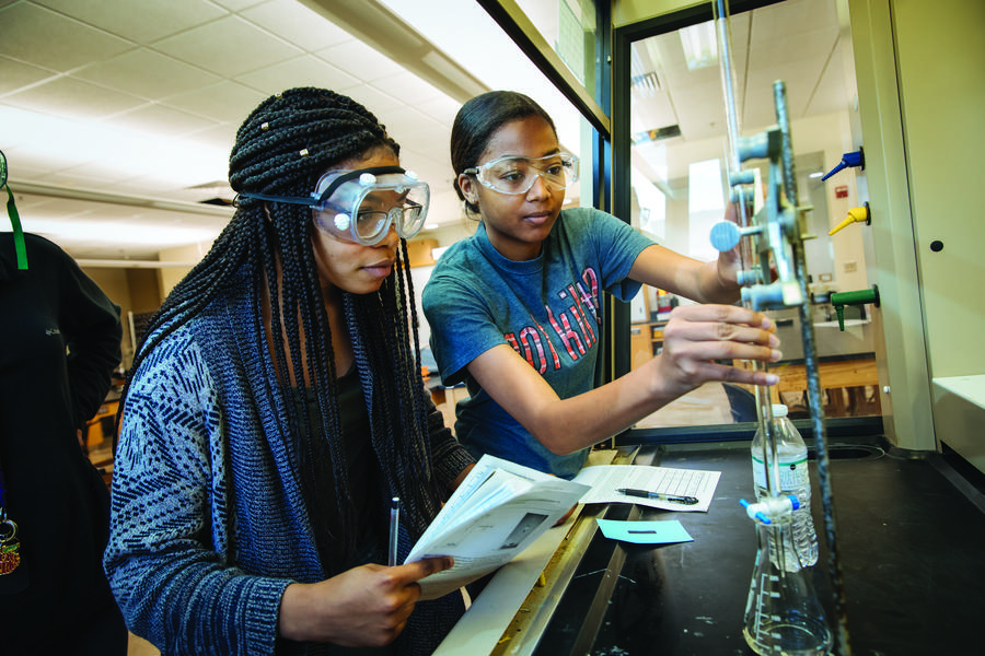 Two students in a science classroom