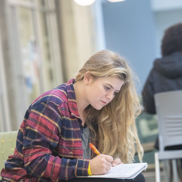 A business management major student working on a project.