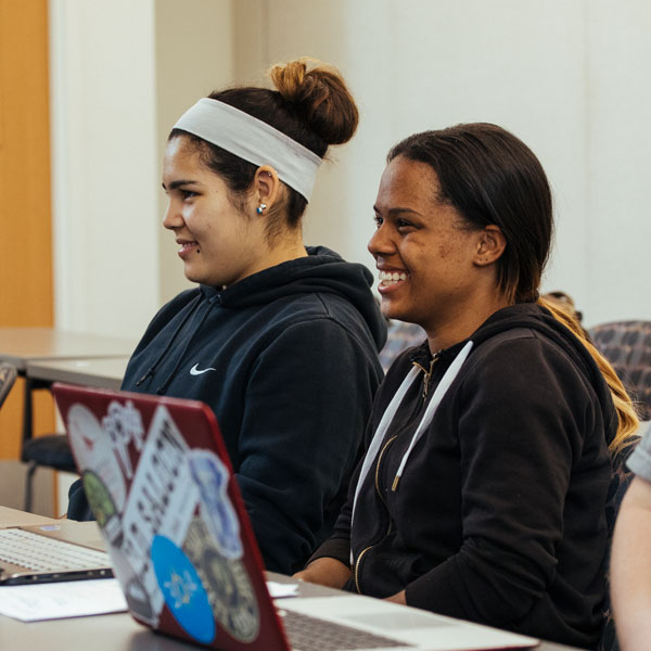 Two creative writing major students participating in a class discussion.