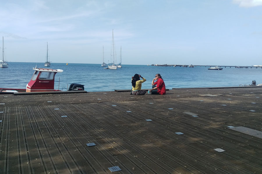 Two Agnes Scott study abroad students chatting in Martinique in 2018.