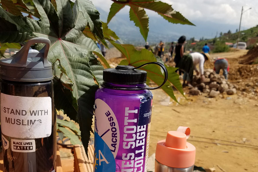 Agnes Scott water bottle in front of tree