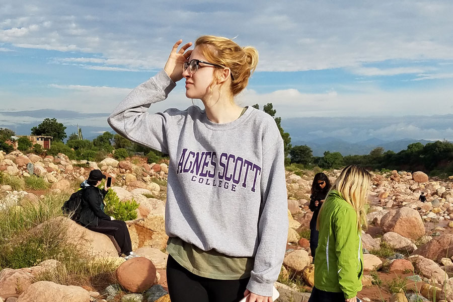 woman in a field of rocks 