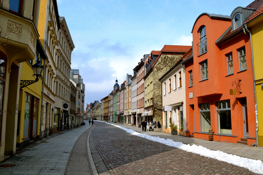 Colorful houses lined along Whittenburg Street, a cobblestone street in Germany.