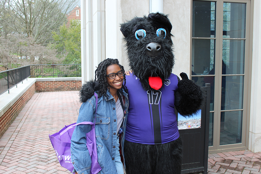 Student poses with Victory, Agnes Scott's mascot.