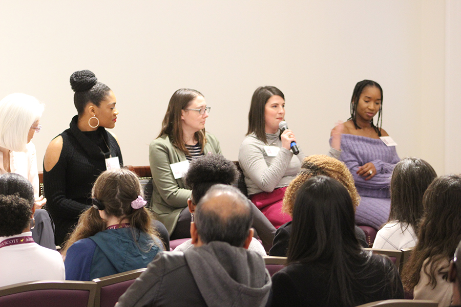 Four Agnes Scott alums with microphones speak in a panel.