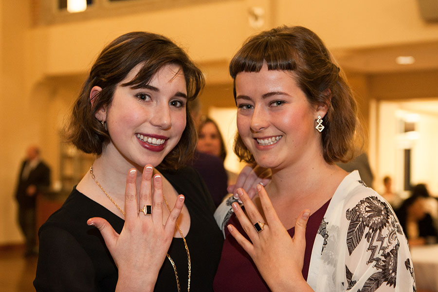 Students holding up black ring