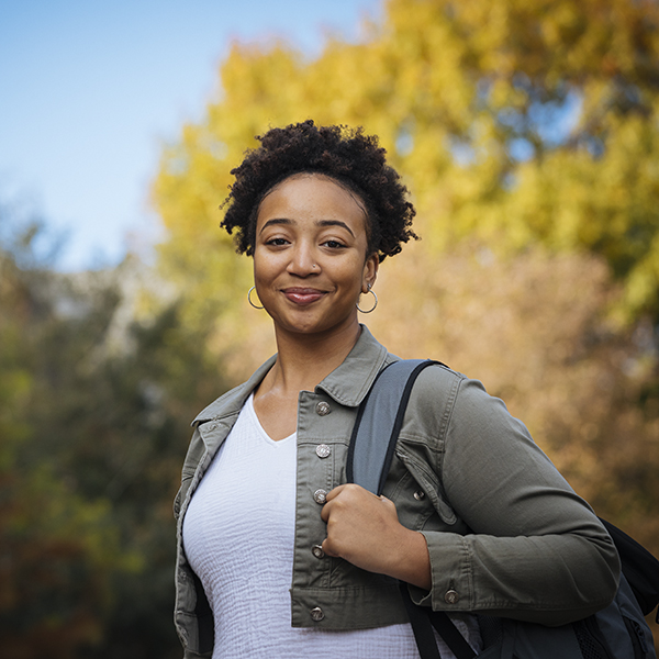 portrait of a student with backpack on shoulder