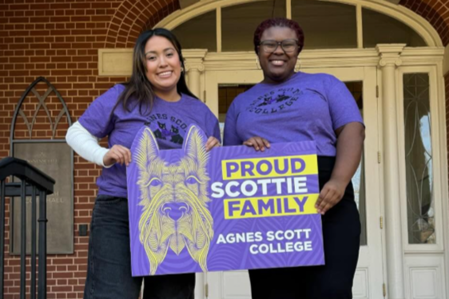 Students with Agnes Scott yard sign