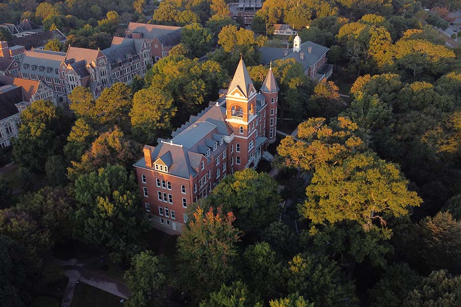 Aerial view of campus showing tree canopy