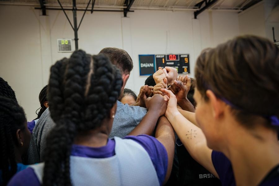 Athletes in huddle