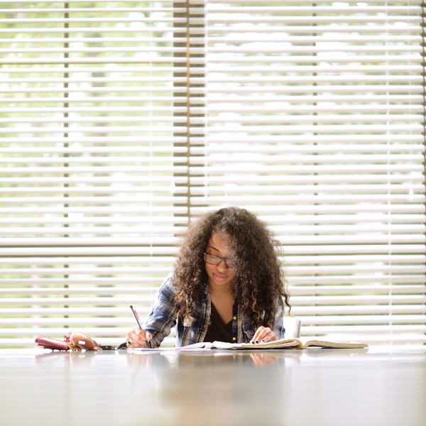 Student studying at a table