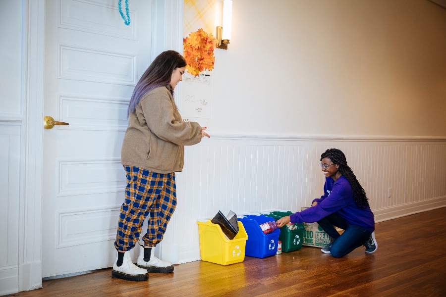 Agnes Scott students recycling. 