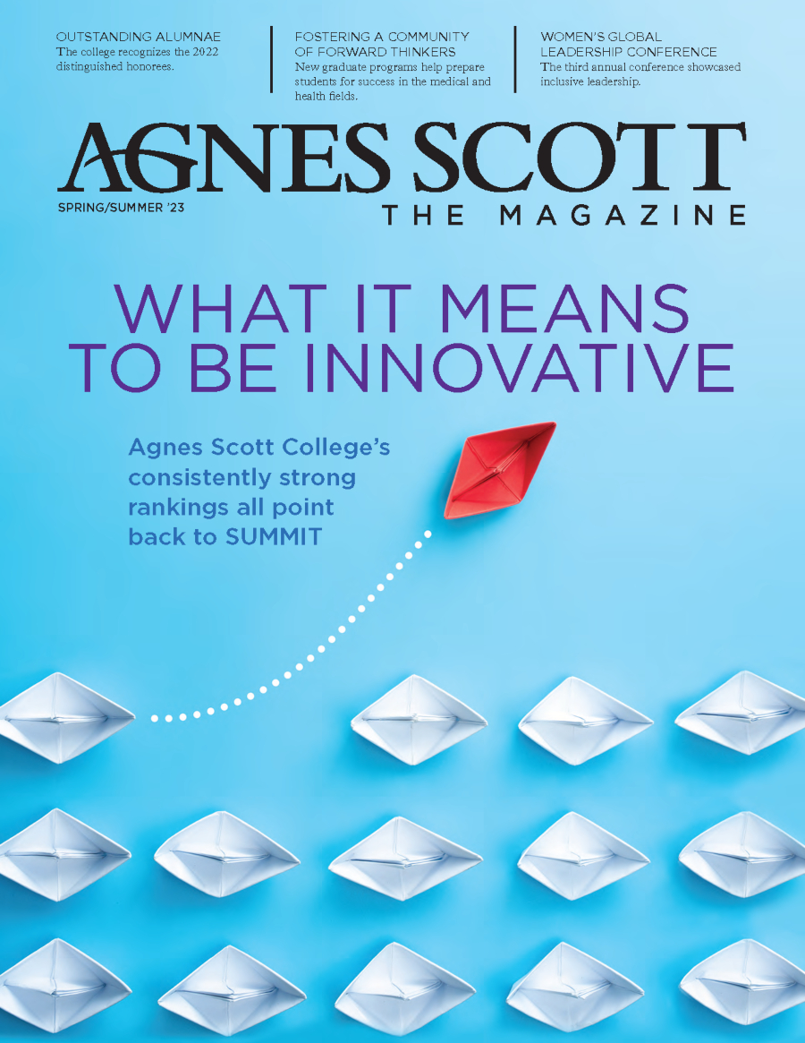 Agnes Scott the Magazine Spring/Summer 2023 Issue Cover. A blue background. Two lines of paper boats with one red paper boat trailing off from the group toward the title.