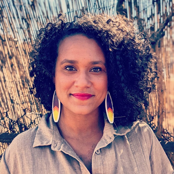 a woman smiles for the camera