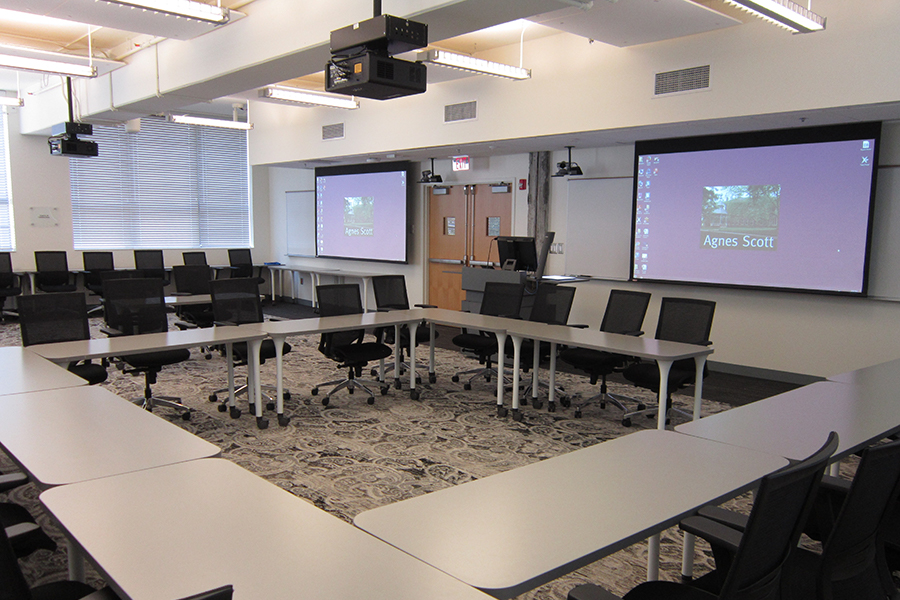 View of Campbell 115 seating arrangement and projection screens