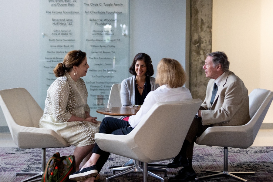 faculty talking around a table