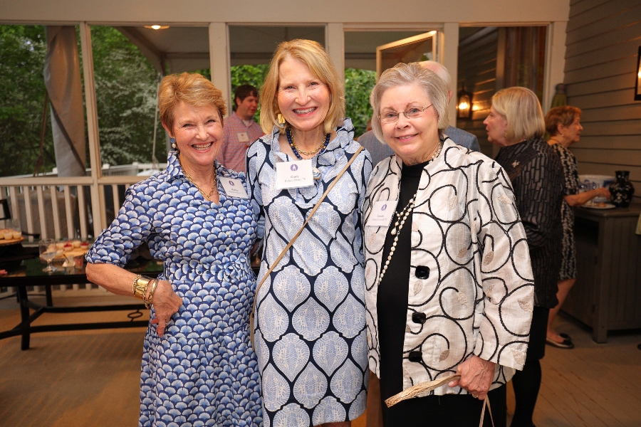 A group of people dressed up stand together for a photo. 