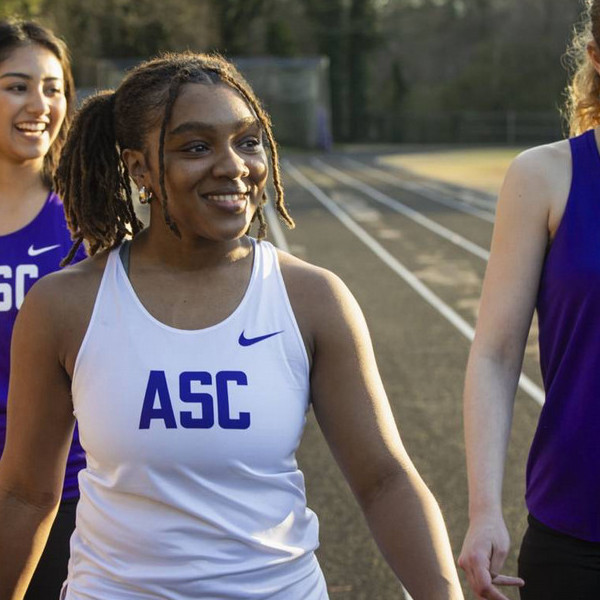 Agnes Scott student athlete walking on track