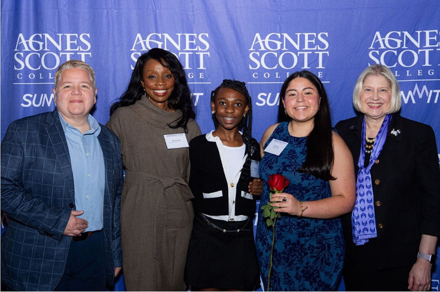 A student award recipient poses with family members, donors, and college representatives at the 2026 Student Award Celebration. The group gathers together to celebrate the student’s academic success and leadership.