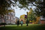 Move to Two students walking on the campus quad slide