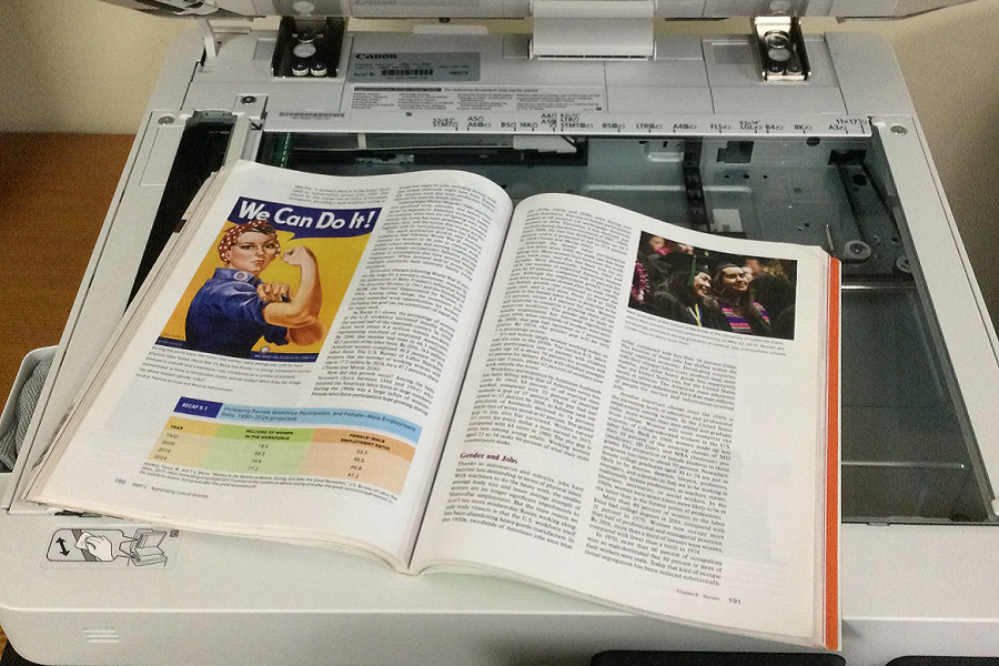 an open book on top of a photocopier