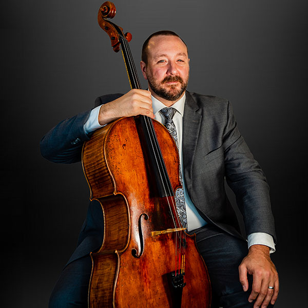 Barney Culver seated with cello