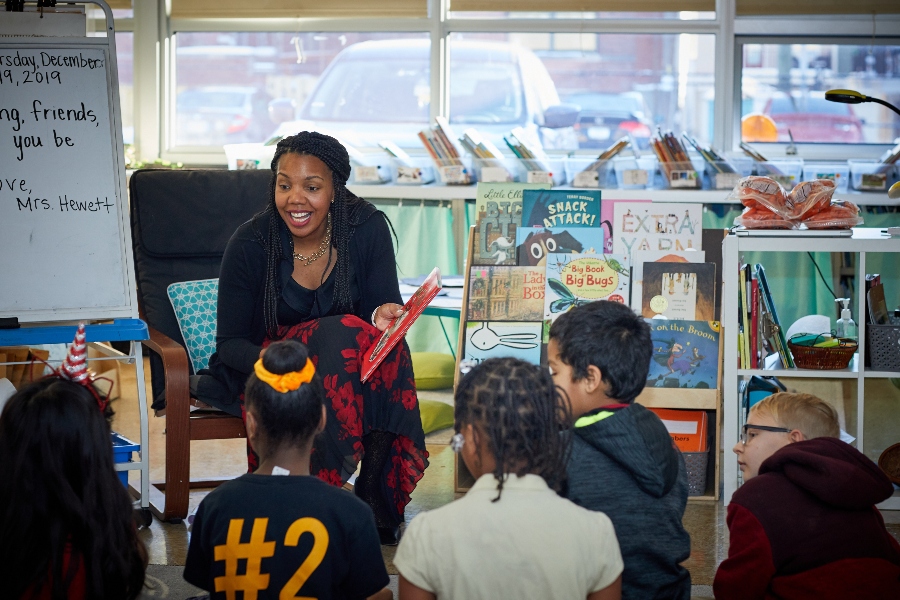 Aleesia Tolliver Johnson reading book to kids