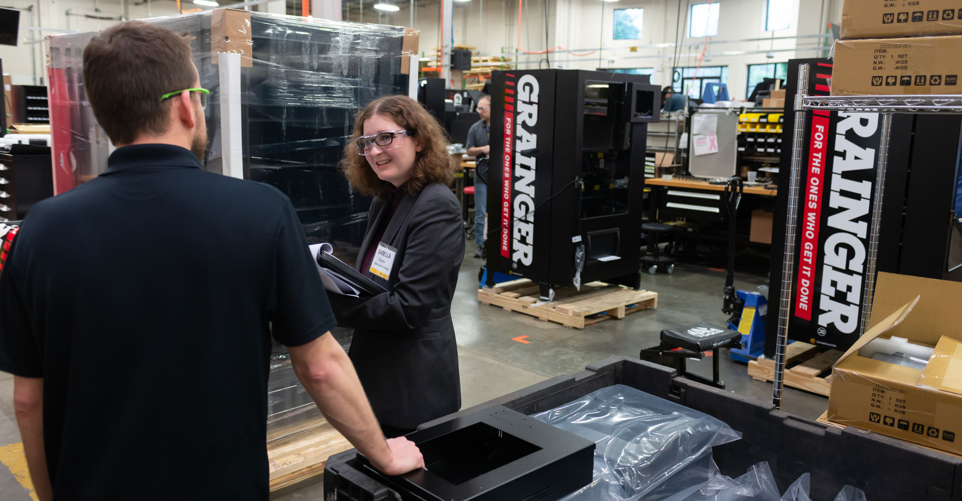 An Agnes Scott Summit student talks with an employee at her internship site.